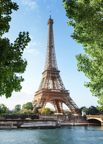 Eiffel Tower in Paris with surrounding greenery.