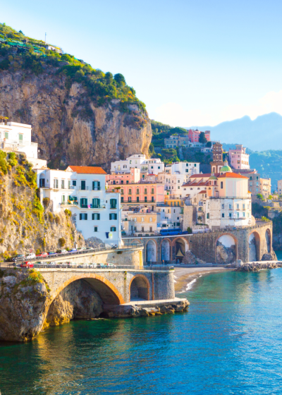 Colorful coastal buildings by the azure sea.
