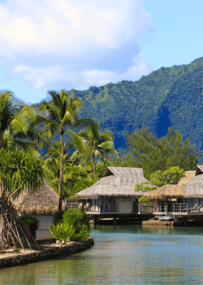 Tropical overwater bungalows by a serene lagoon.