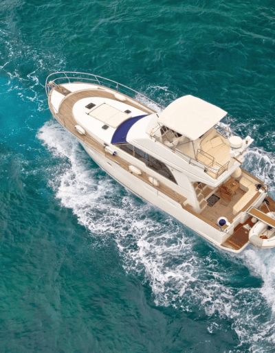 Aerial view of a luxury yacht on water.