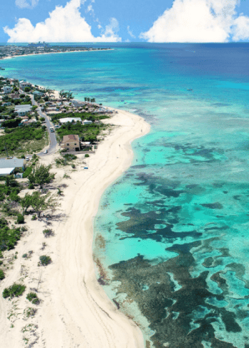 Aerial view of a tropical beach with turquoise water.