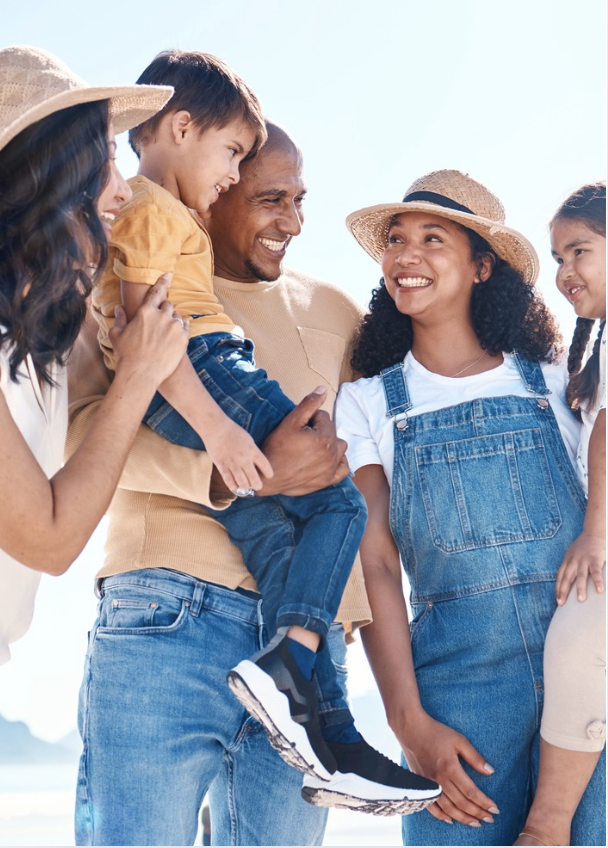 Family enjoying a joyful moment together outdoors.