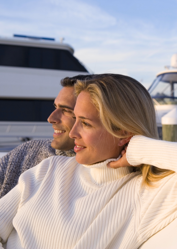 Couple enjoying a sunset on a boat.