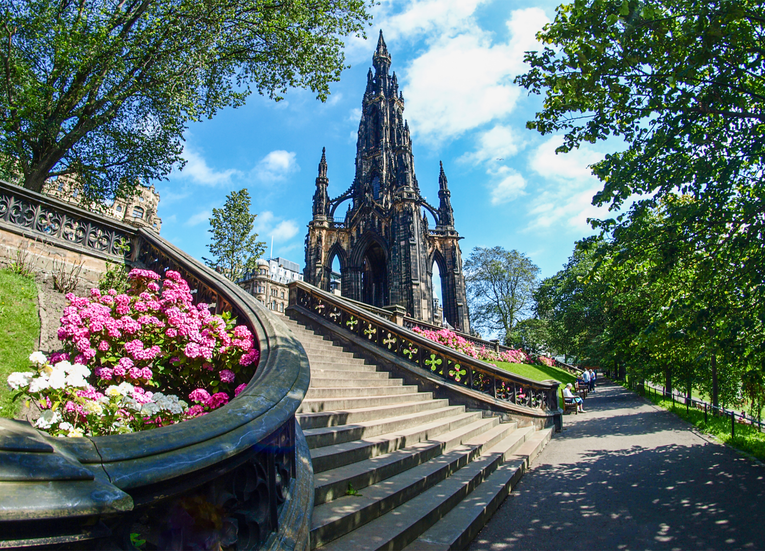 Scott Monument with colorful flowers and stairs, Edinburgh.