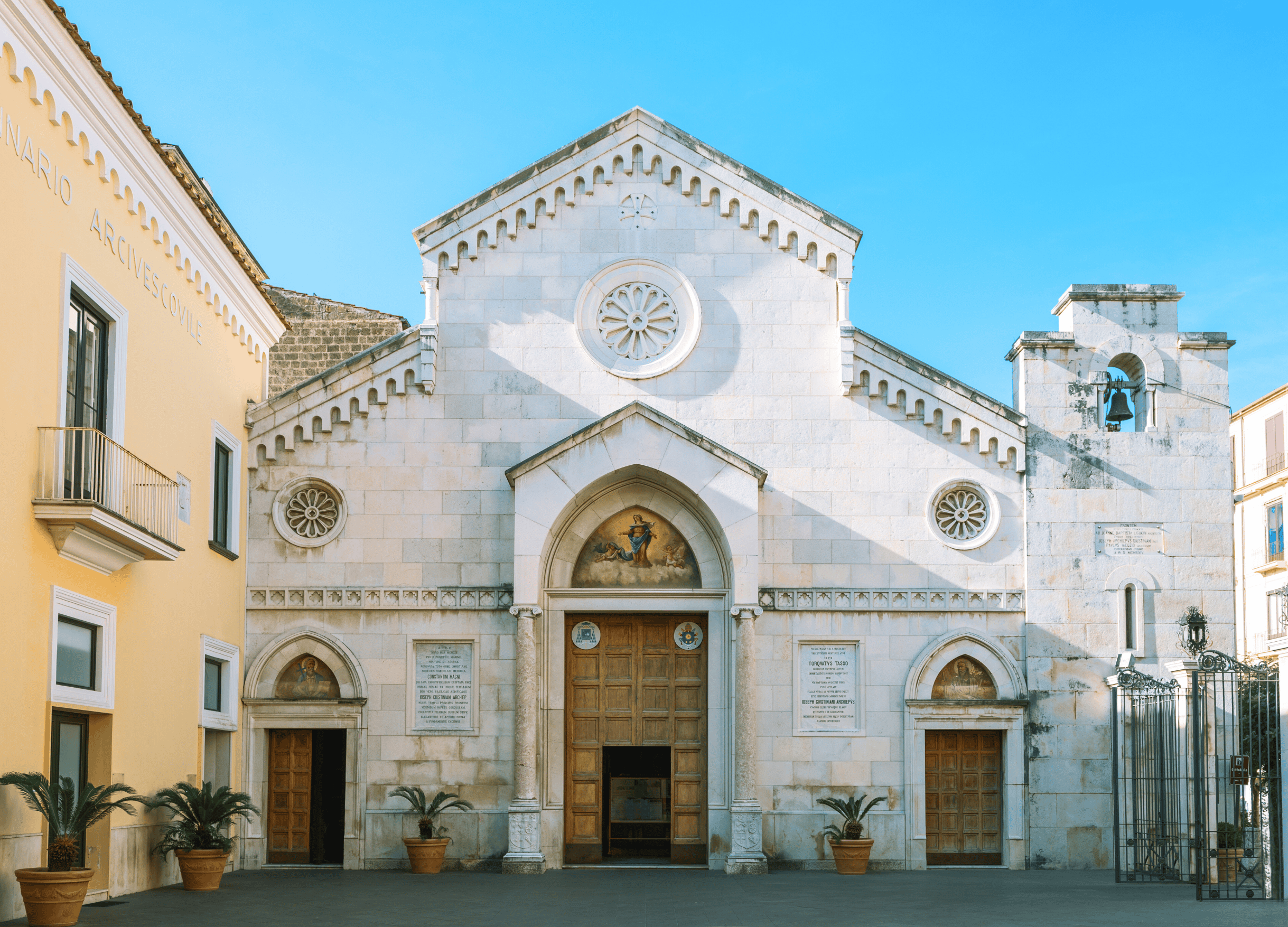 Historic church facade with blue sky background