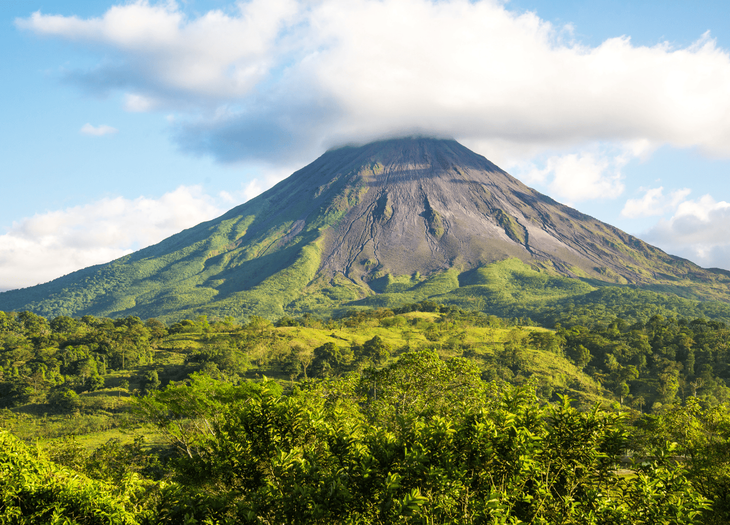 Arenal Volcano in Costa Rica with cloud cap.