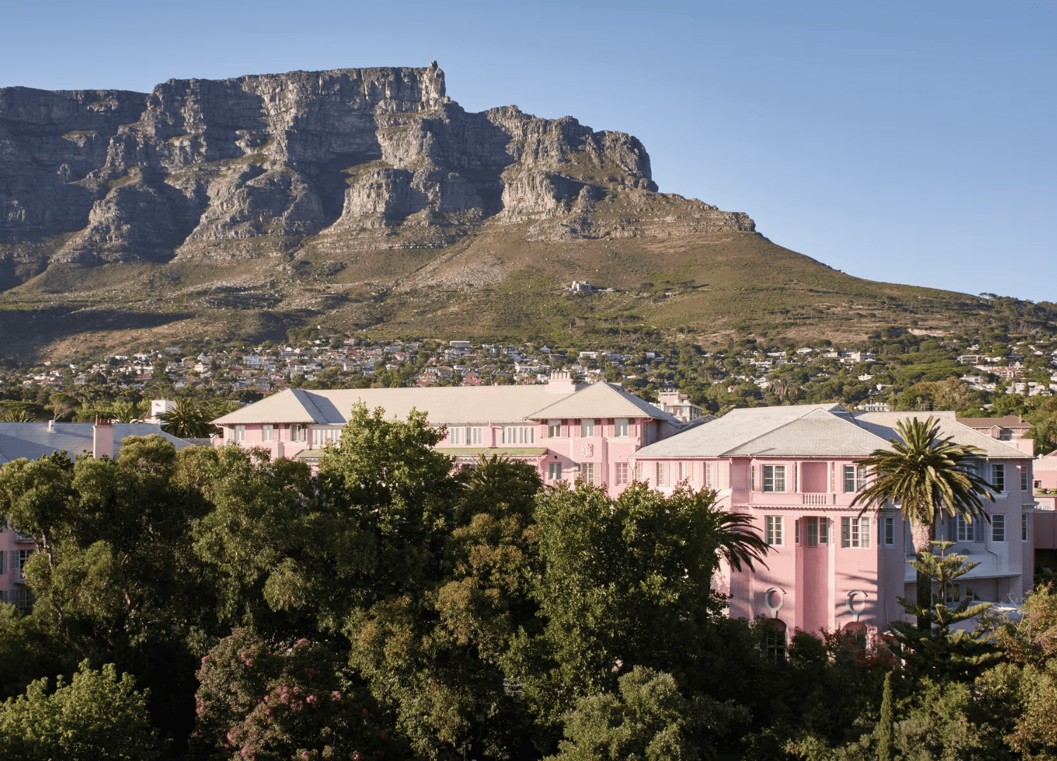 Pink building with mountain in background