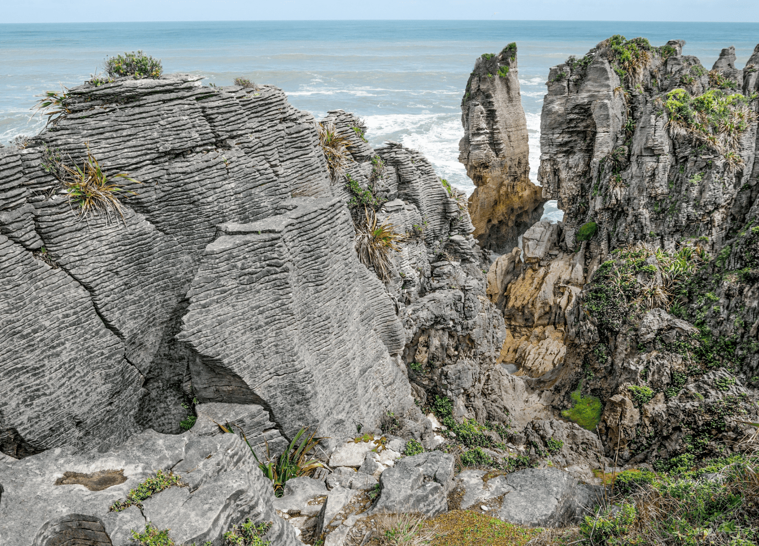 Eroded limestone rock formations by the ocean.