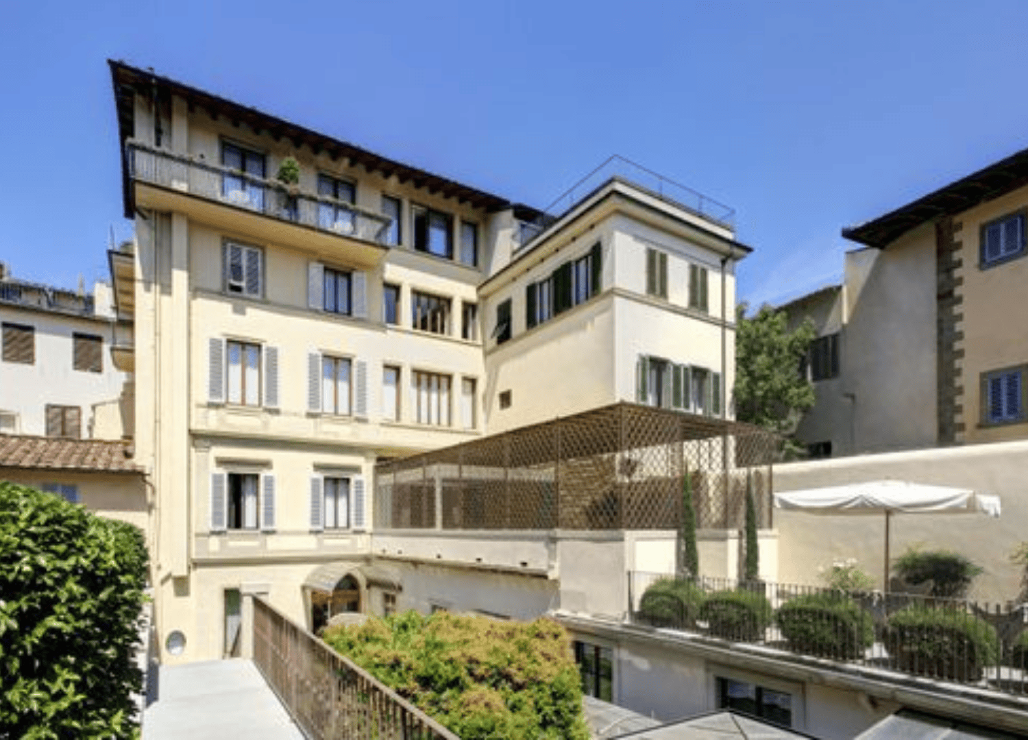 Sunny courtyard of multi-story residential building.