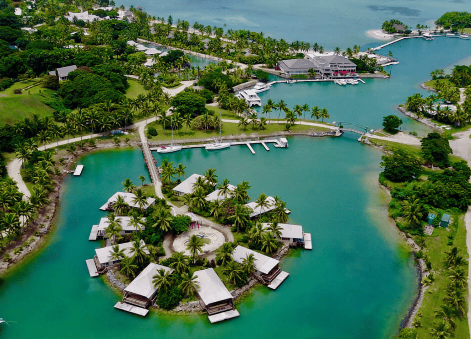 Aerial view of tropical island resort with lagoon.