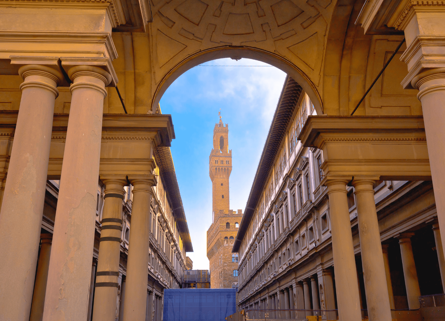 View of tower through historic columns, Florence, Italy.