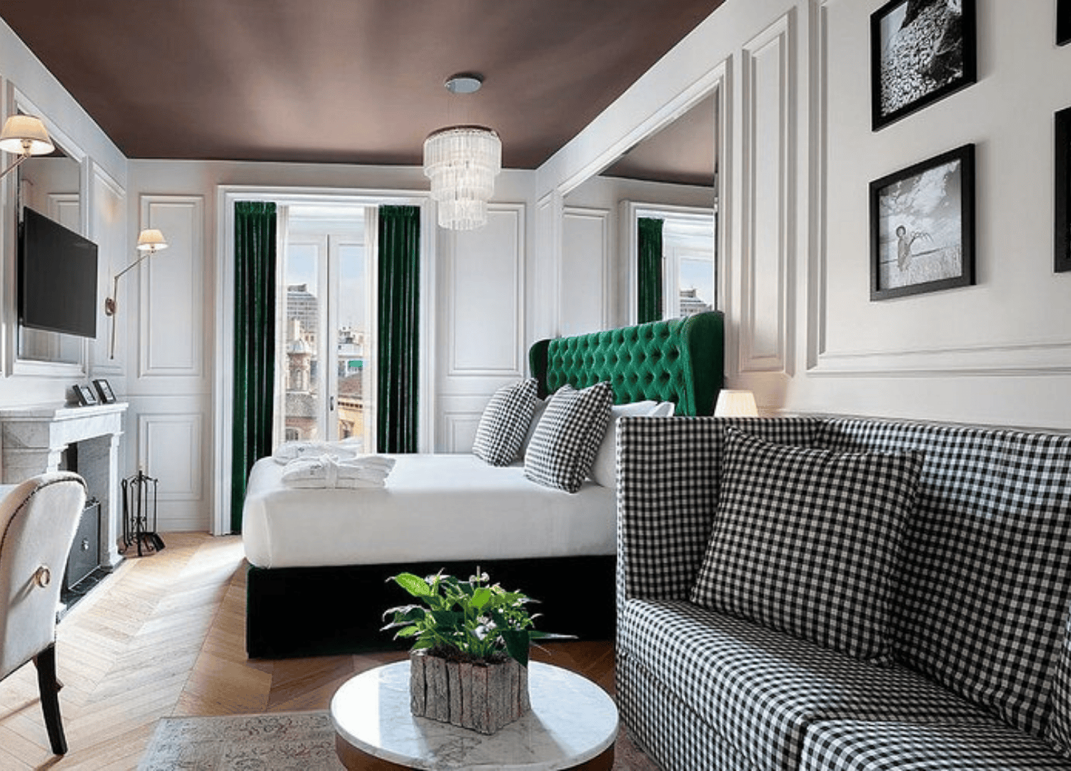 Elegant hotel room with checkered decor and plants.