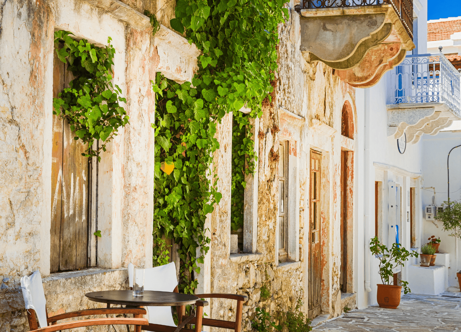 Charming rustic building with lush green vines.