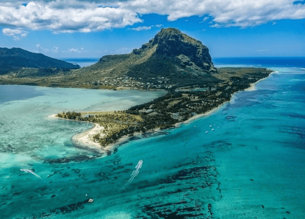Aerial view of tropical island with turquoise waters.